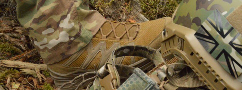 close up of LOWA Military Boot being worn outdoors next to military kit